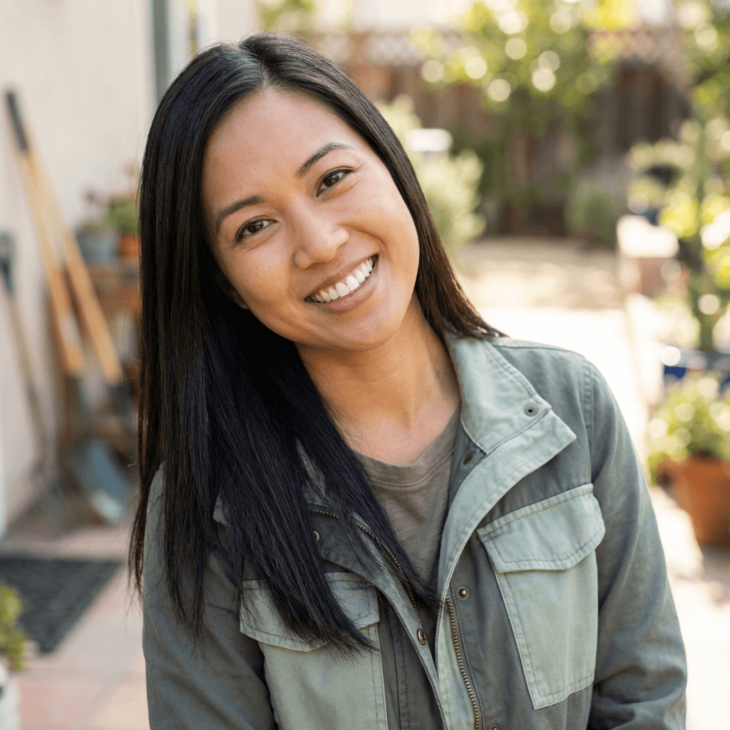 Female homeowner smiling in a bright living room